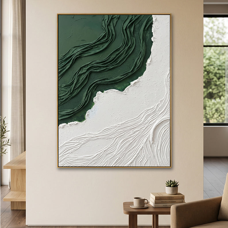 Close-up of textured forest green relief art in a sunlit modern entryway setting.