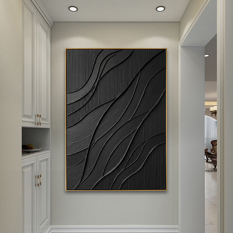 Close-up of black wave-patterned texture art in a luxury home foyer.