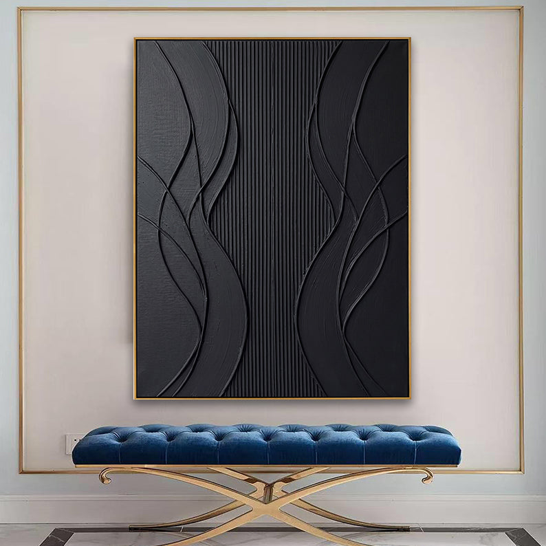 Large 3D textured black abstract painting mounted above a blue velvet bench in a luxury foyer.