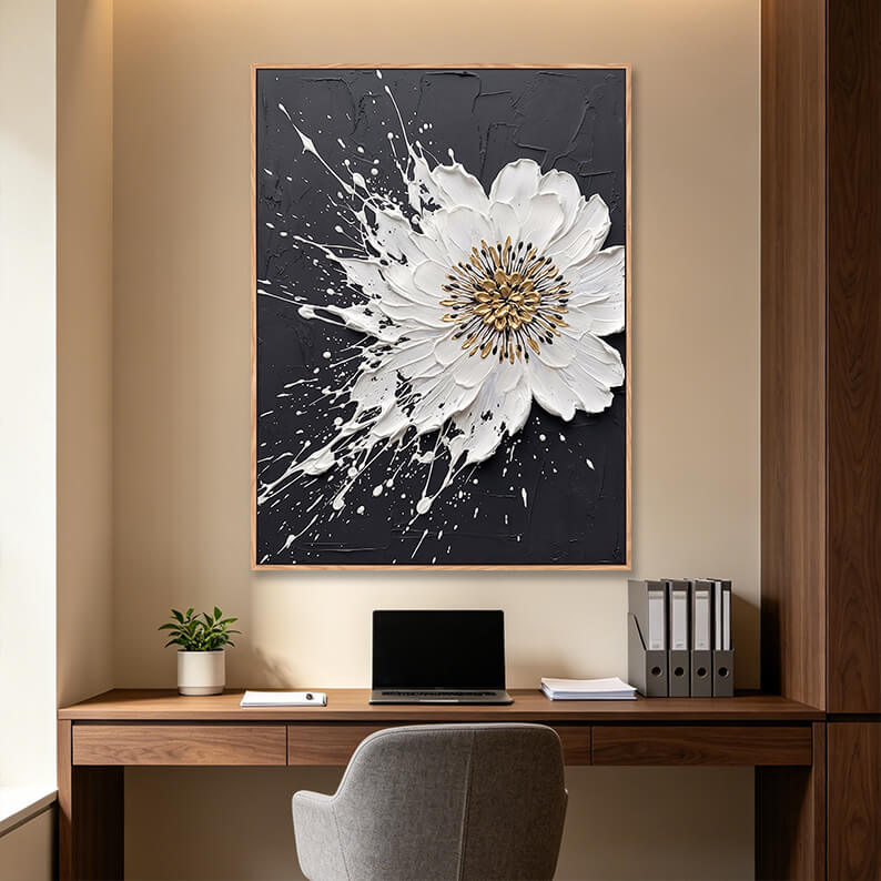 Hand painted vertical black and white splash flower painting with gold center in modern home office, 3D impasto floral artwork above wooden desk