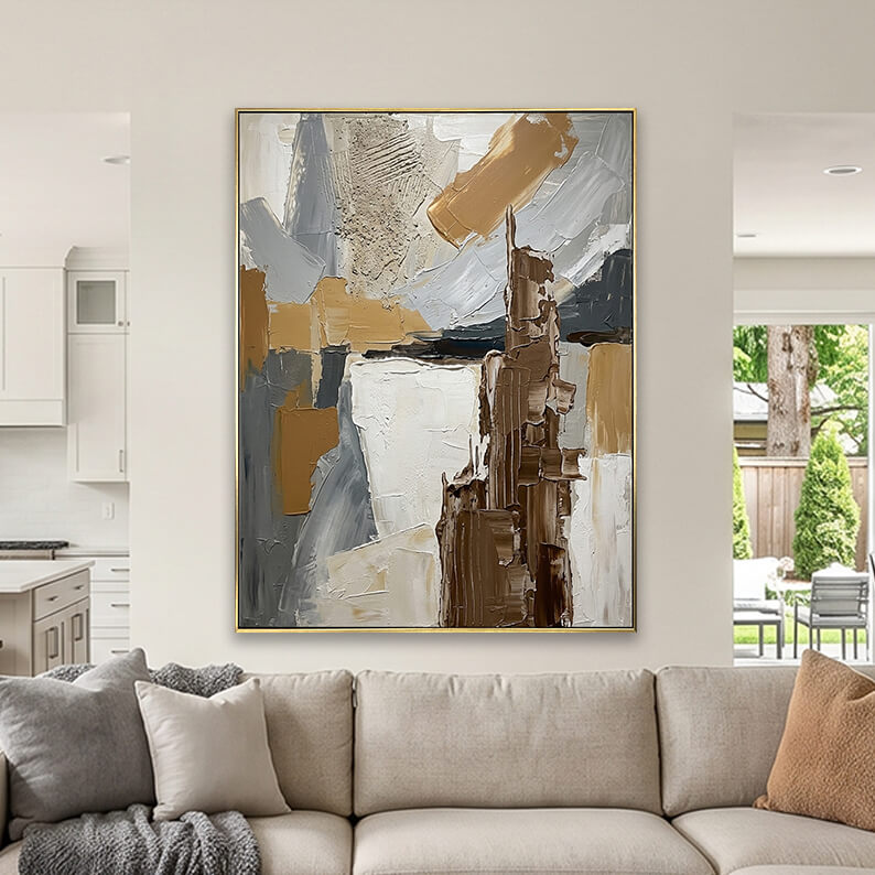 Large hand-painted abstract texture canvas art with thick brown strokes hanging on a wall in a bright sunroom with large windows.