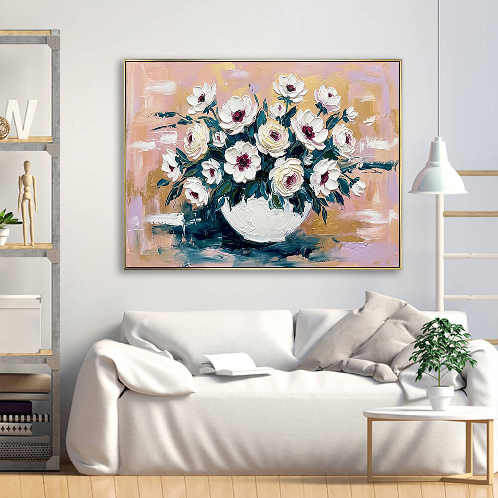 Textured hand-painted flower vase canvas artwork displayed above cream linen sofa in bright minimalist living room